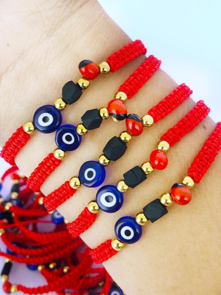 12 Pulseras protección en macramé c/ojo turco, azabache y peonìa